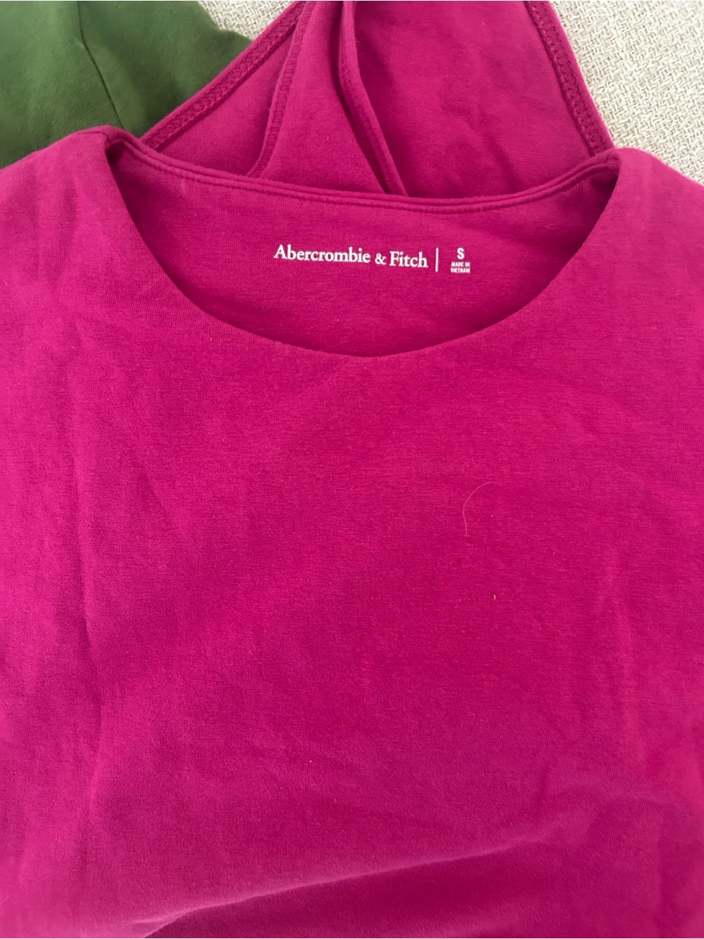 Abercrombie & Fitch Fuchsia crew neck bodysuit. Green sold separately